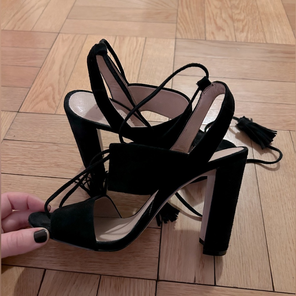 Black suede heels with ankle wrap tassels